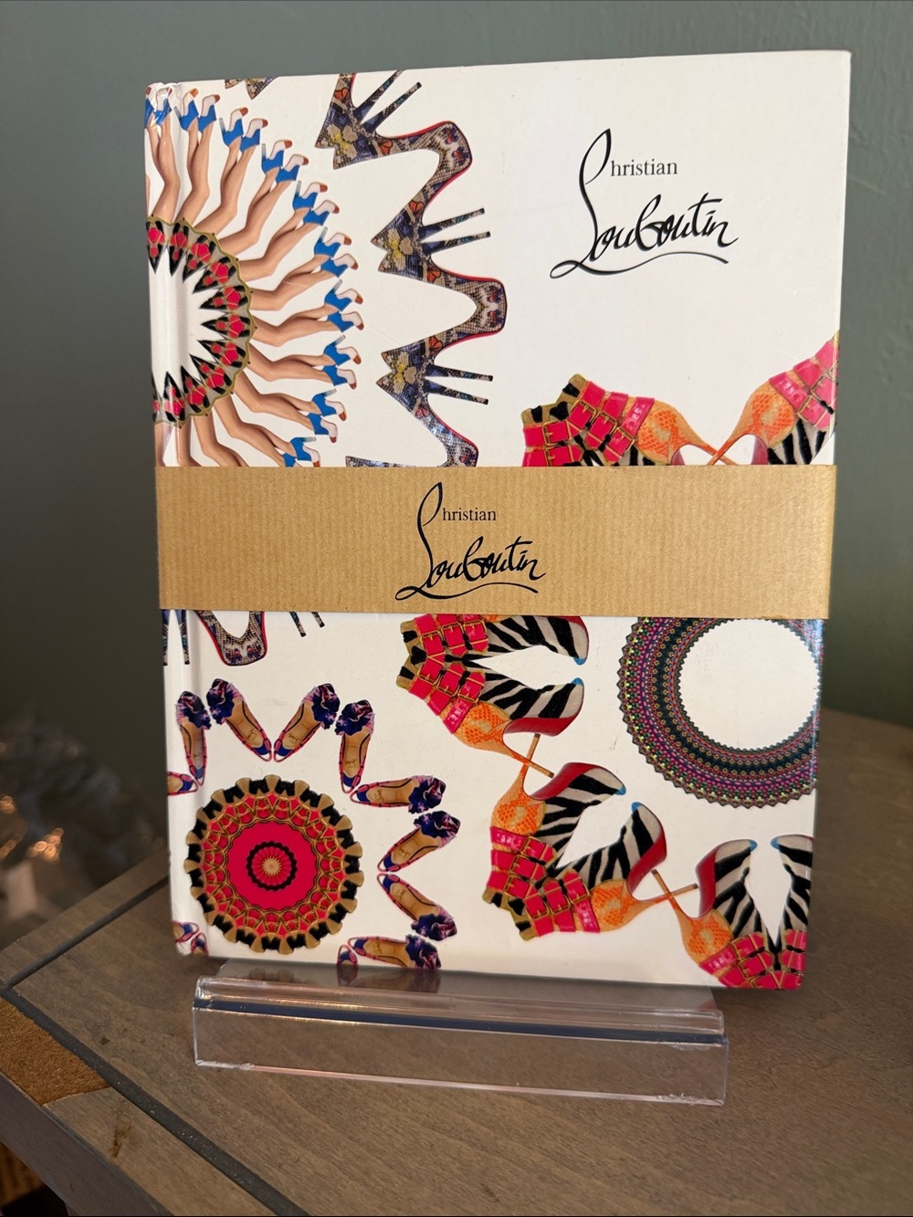 Christian Louboutin White Notebook with Red, Orange, Brown, and Black Accents